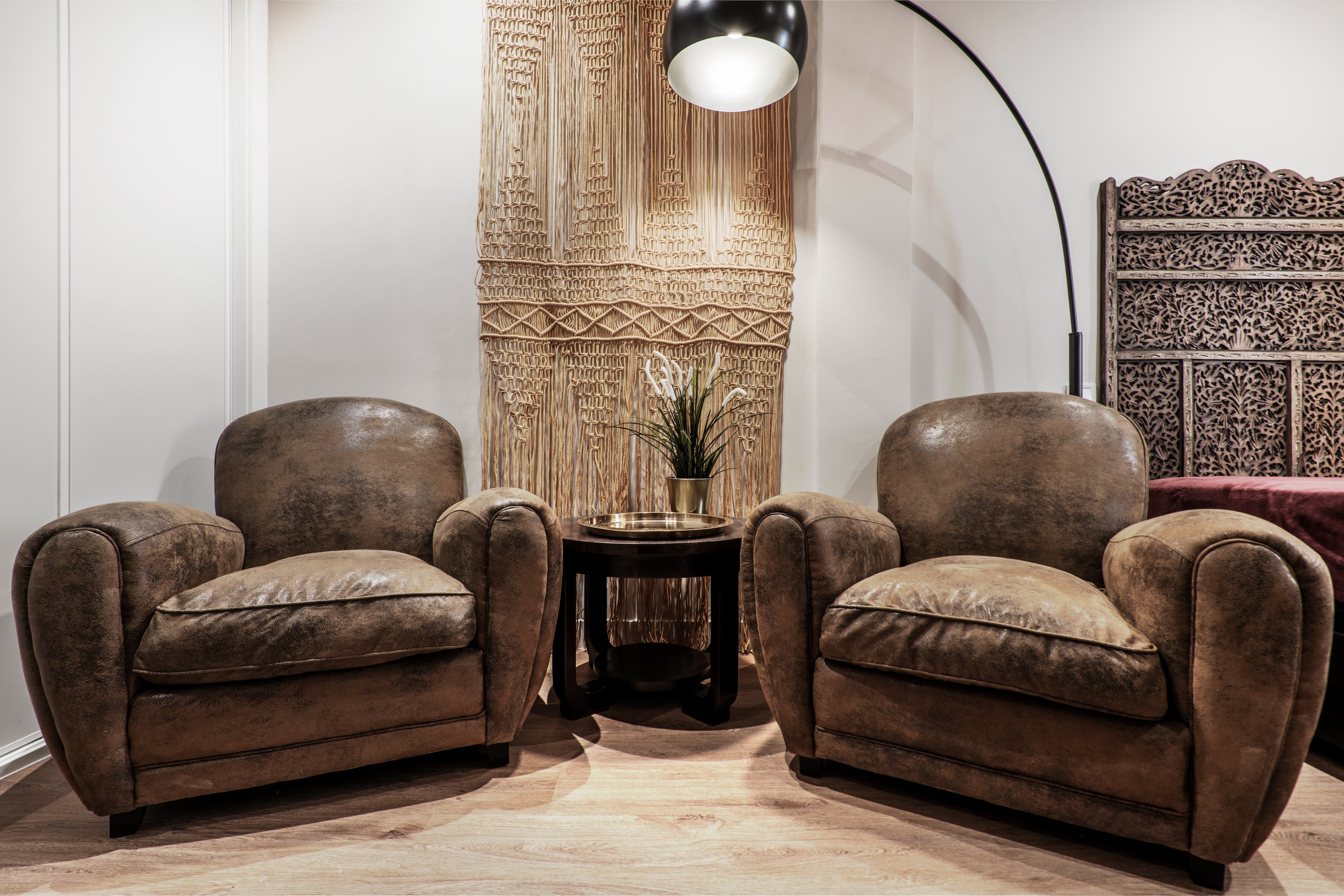 Hanging macrame in living room with accent chairs