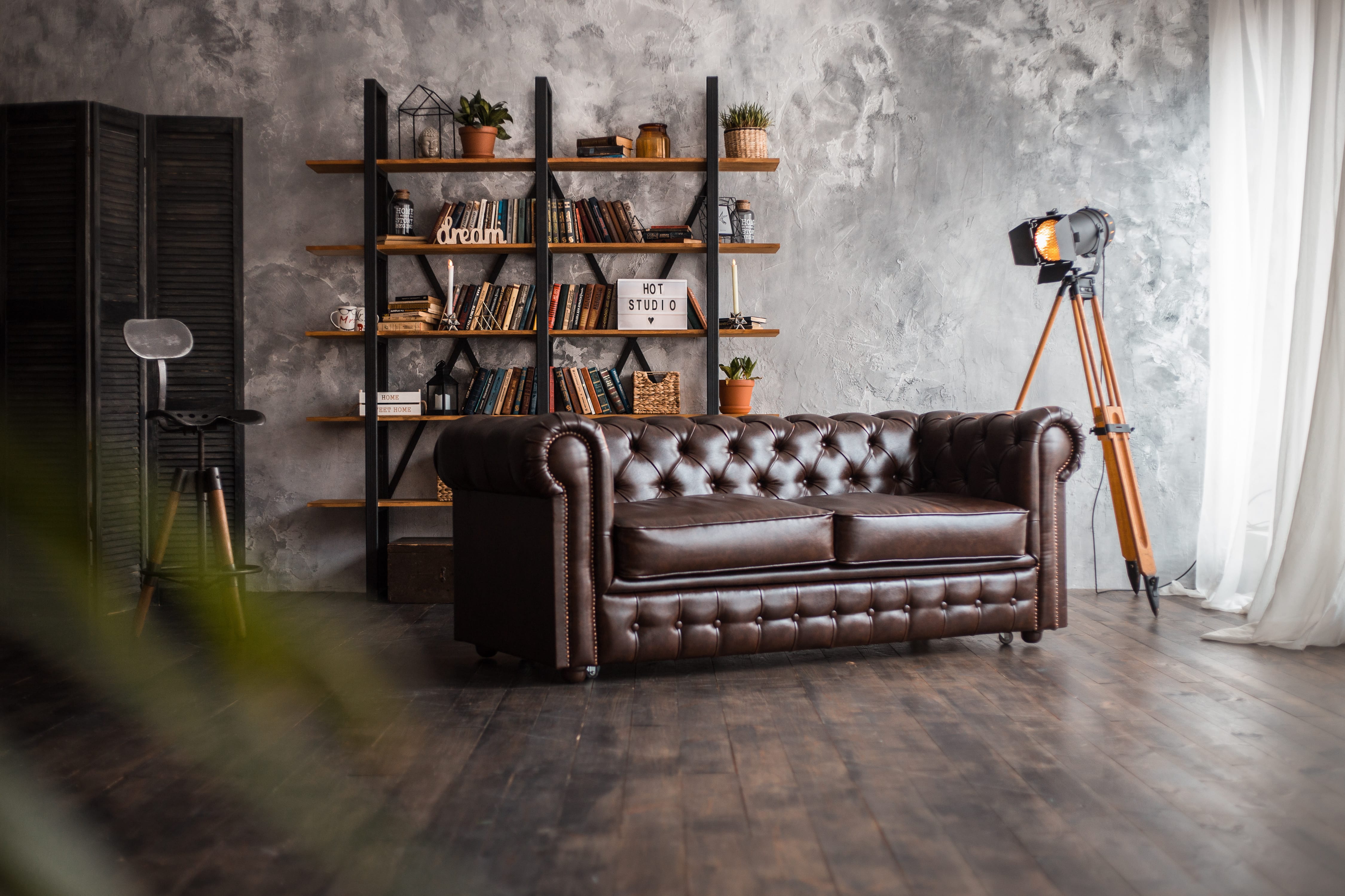 Textured wall paint in living room with leather couch