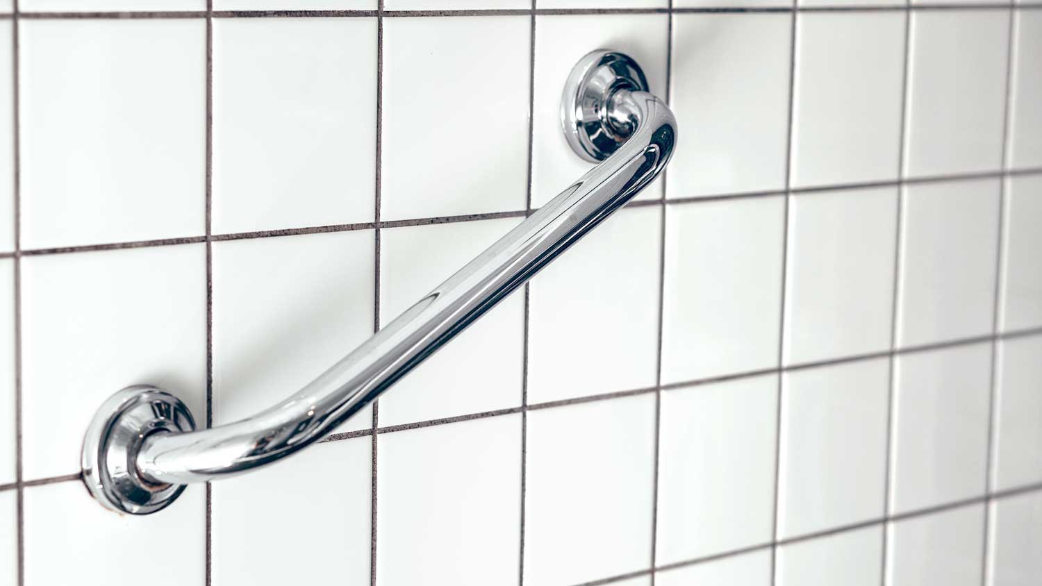 Wall-mounted grab bar installed in the shower