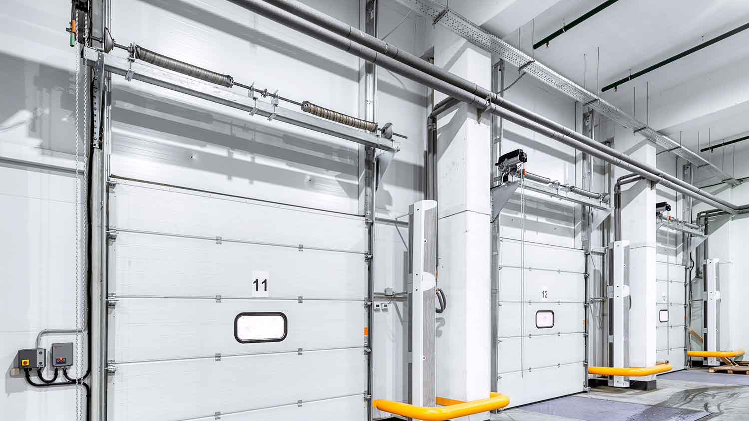 Warehouse door with steel rolling door torsion springs