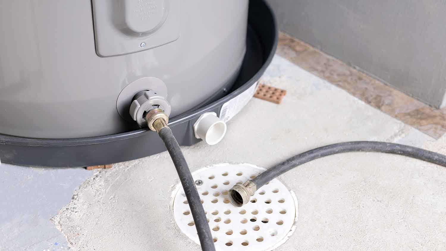 Hose connected to water heater drain valve