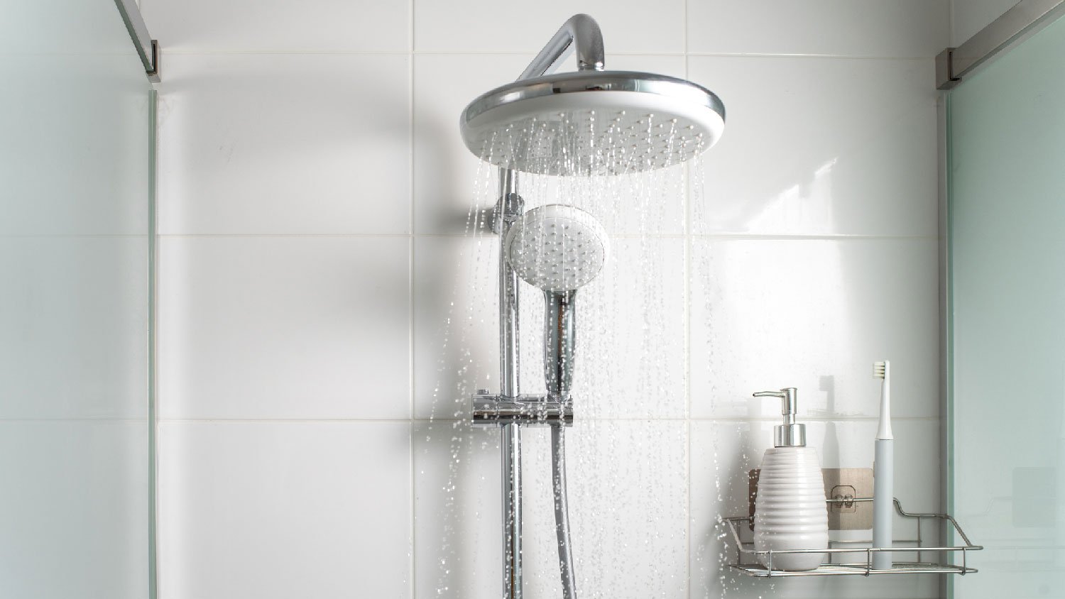 Water running from showerhead in a shower cabin