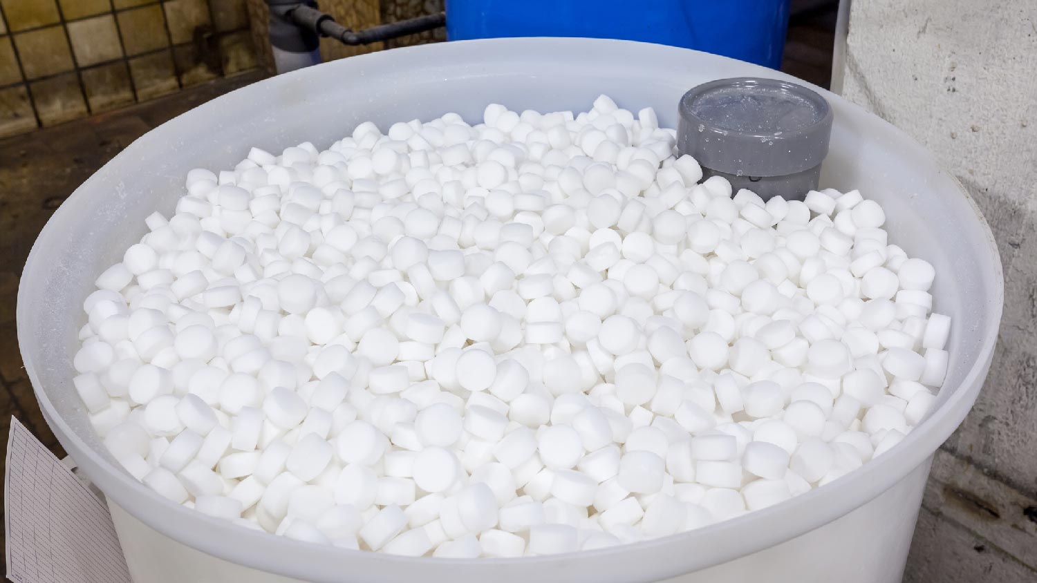 A water softener filled with salt blocks