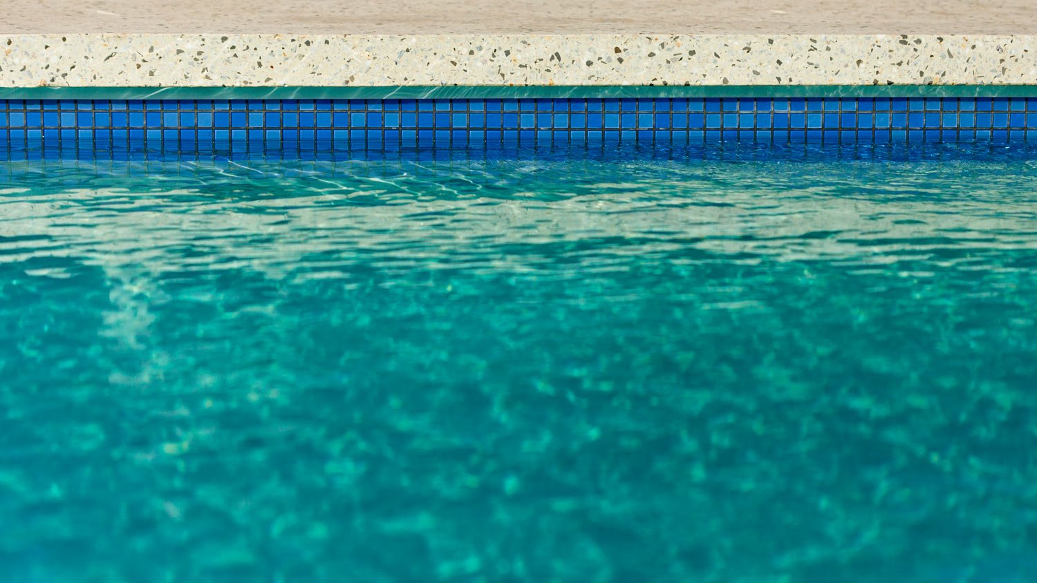 View over water to the edge of a pool