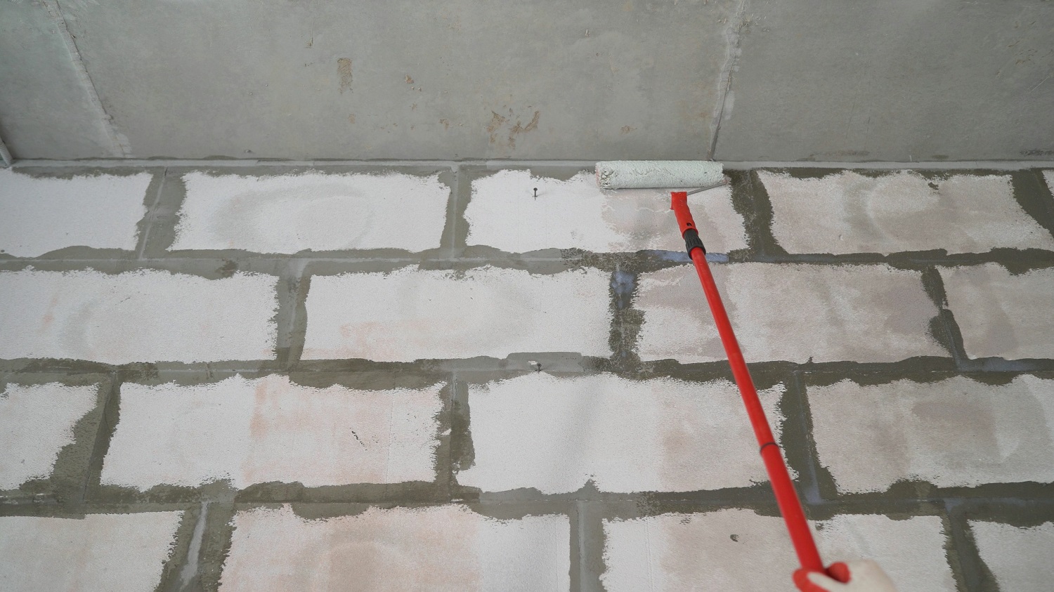 Waterproofing sealant rolled onto wall