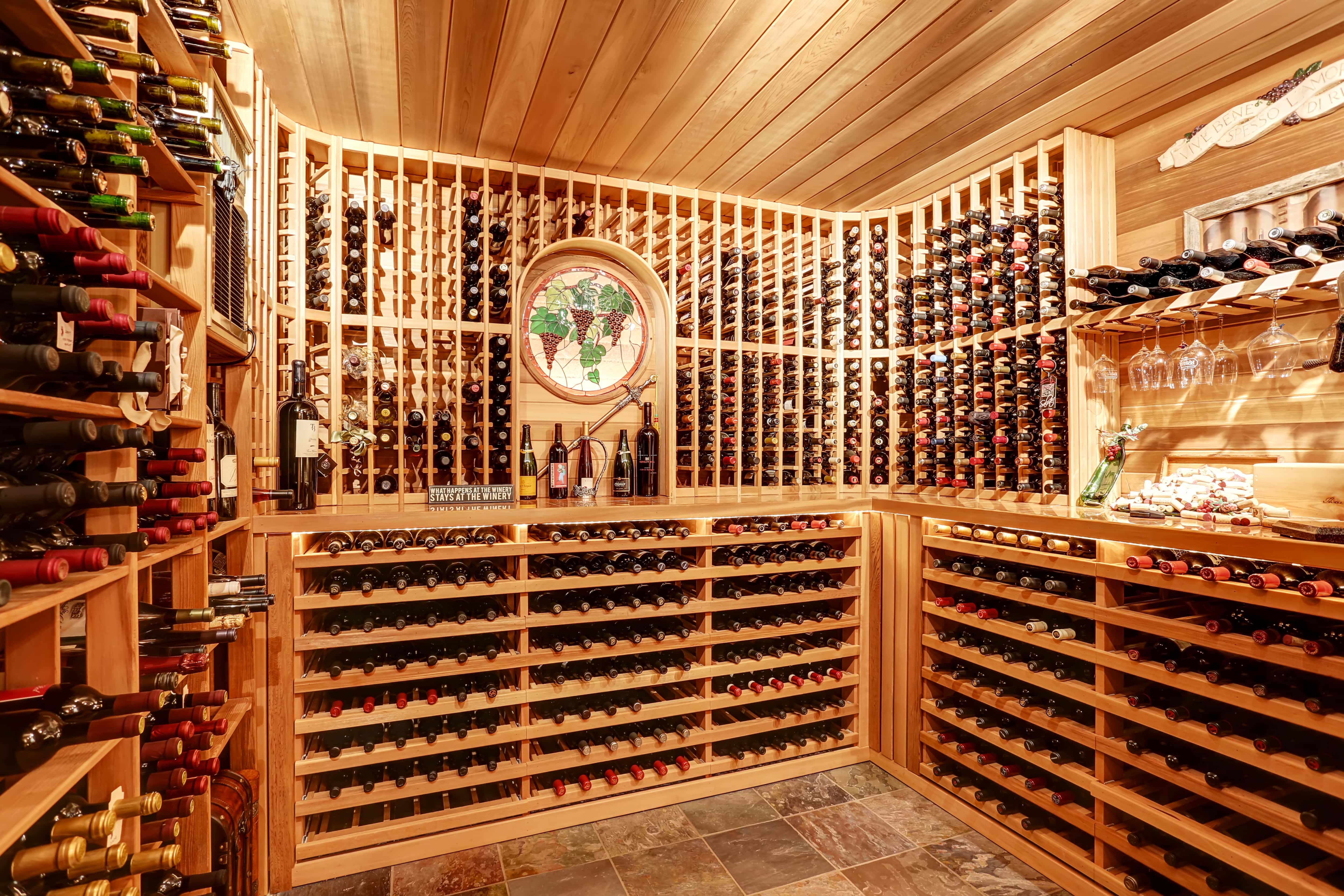 A home basement converted into a wine cellar with a bar