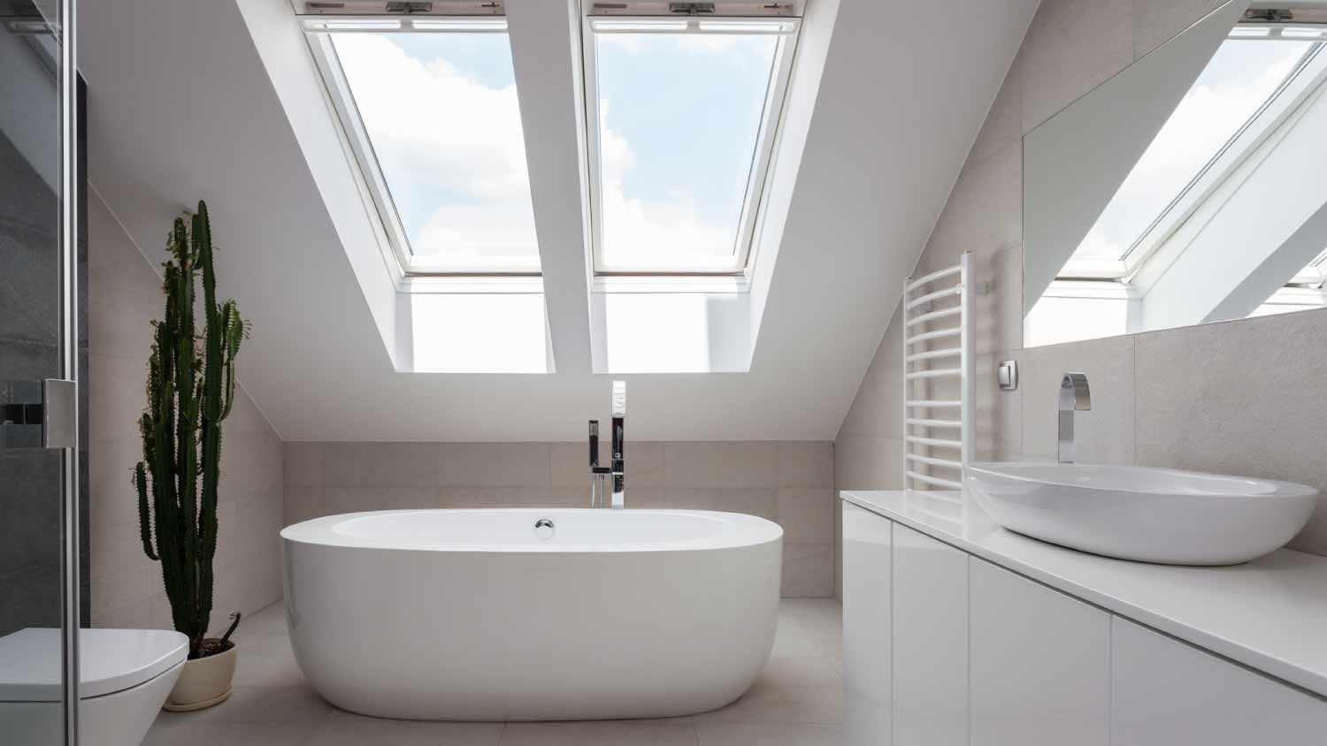 A white bathroom with skylights