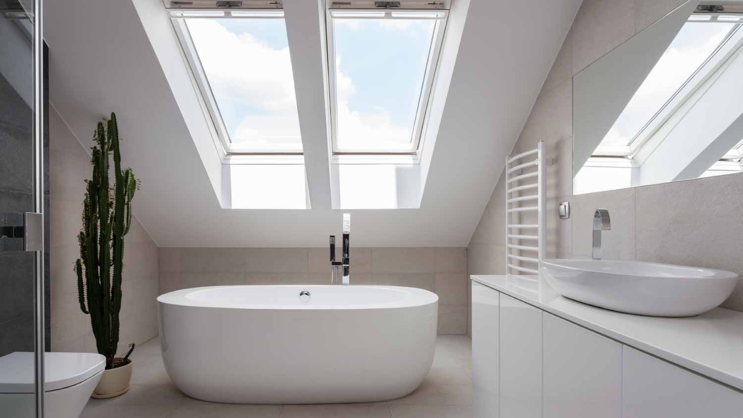 A white bathroom with skylights 