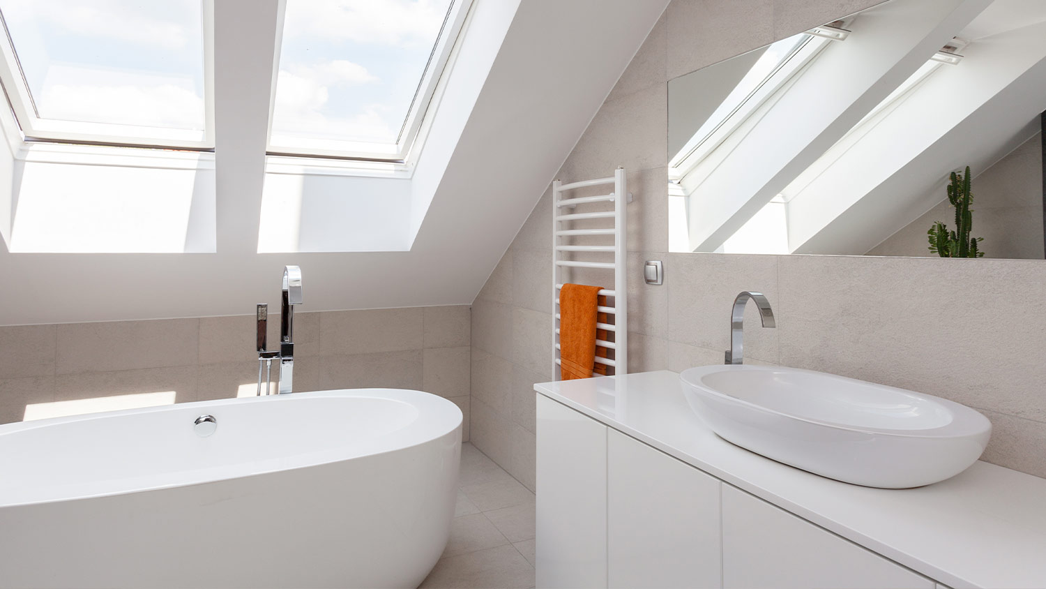 white bathroom with large skylight