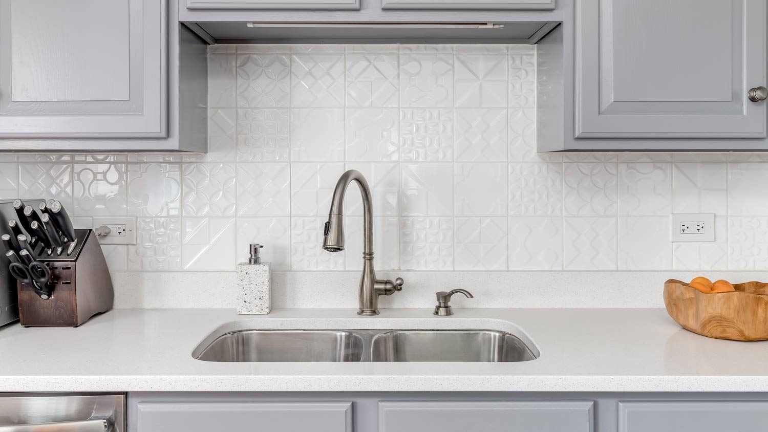 white counter  stainless steel faucet