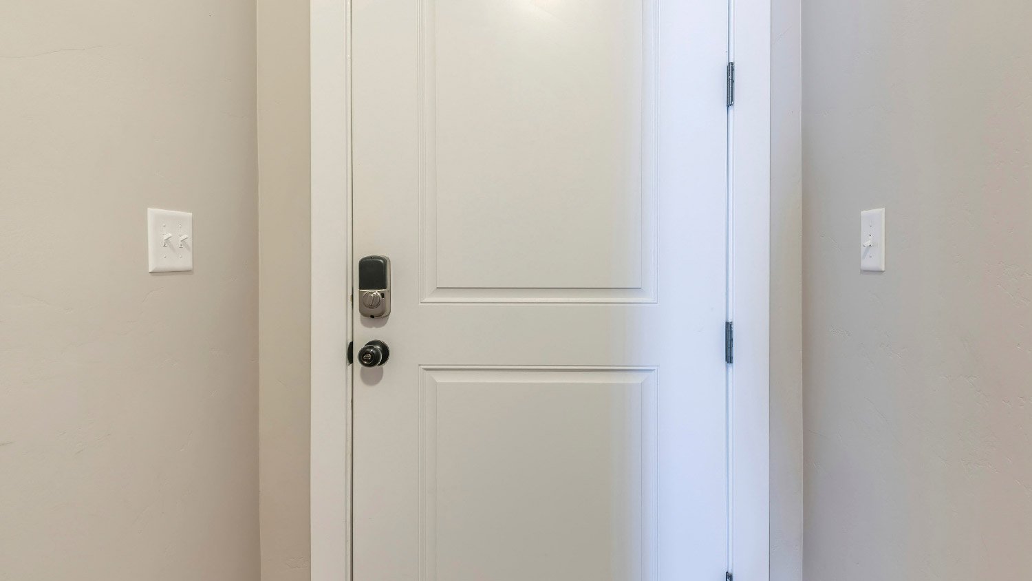 A white fire door with digital access