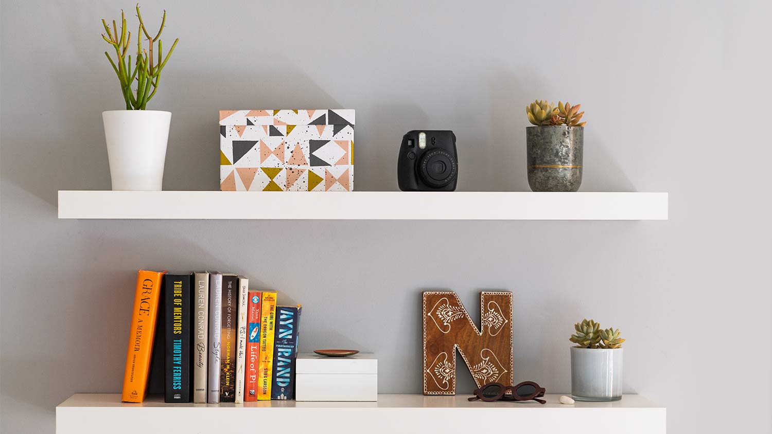 white floating bookshelves