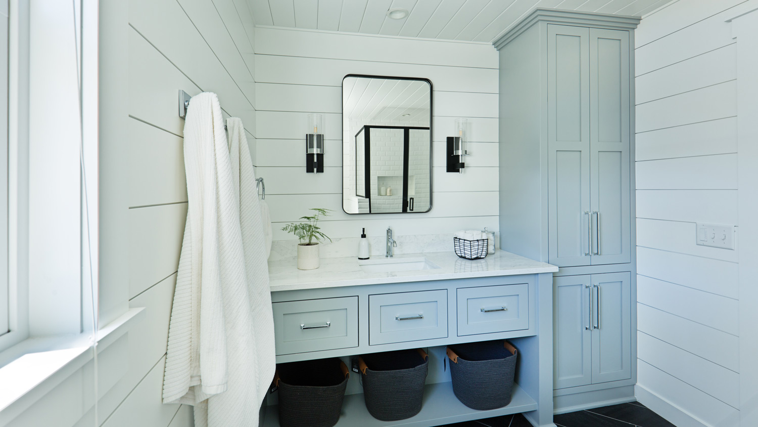 White shiplap covering bathroom walls and ceiling