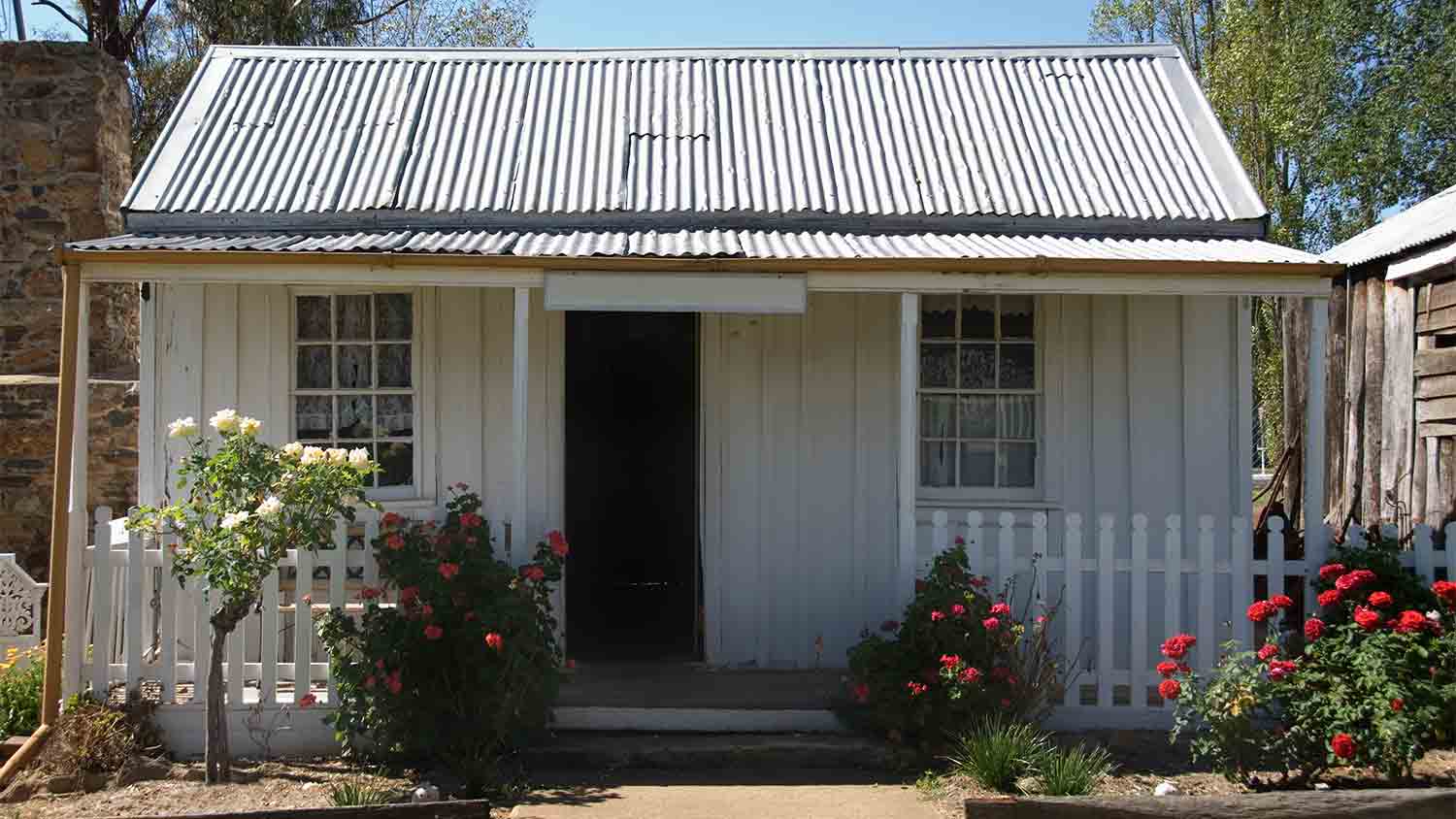 small white tin house