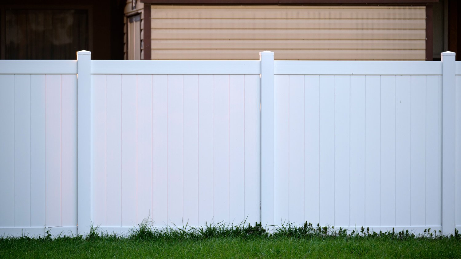 White plastic fence for back yard protection and privacy