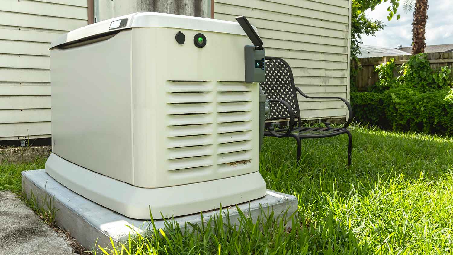 Whole house propane generator sitting on a concrete slab 
