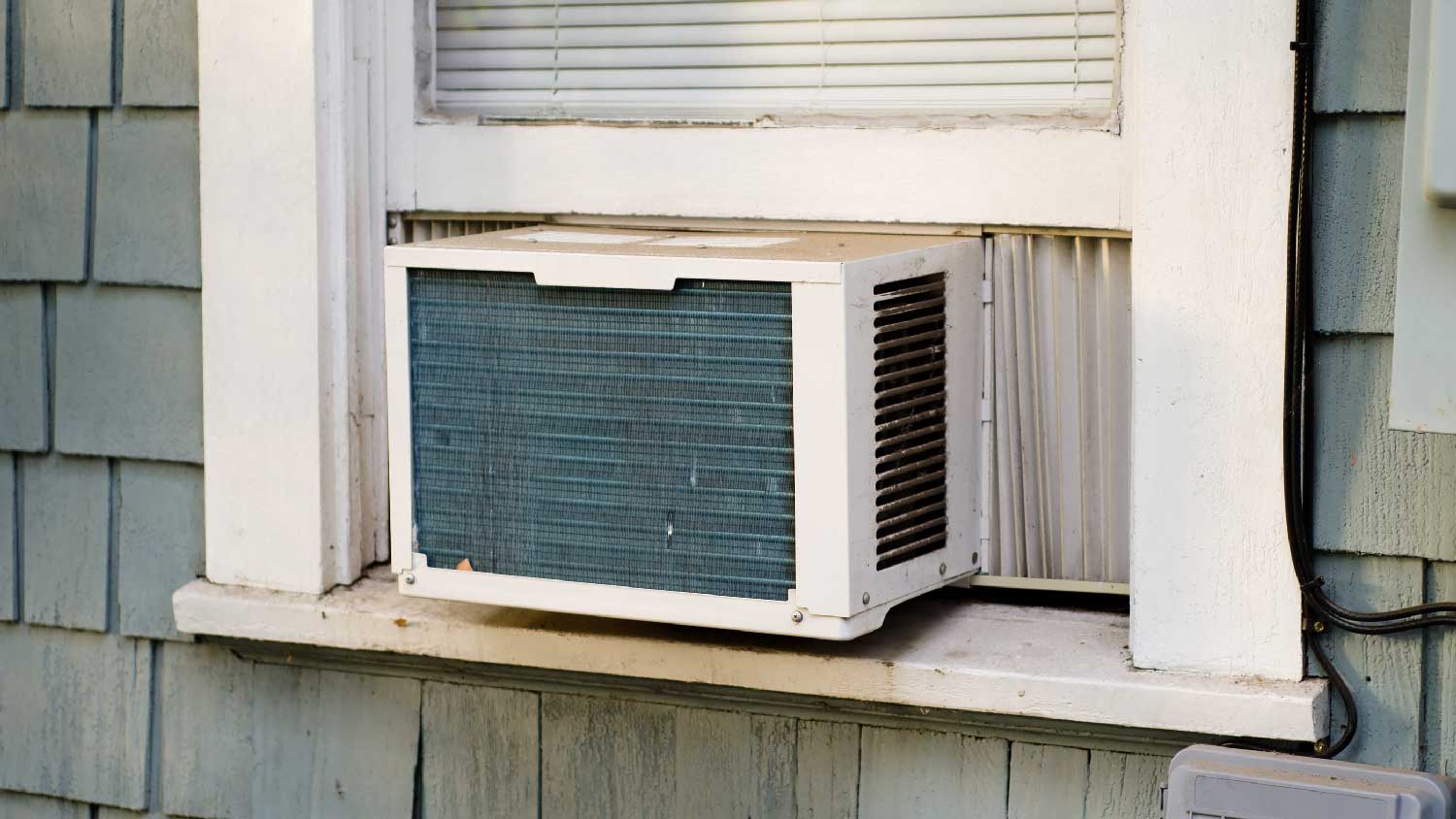 A window AC in a rustic house