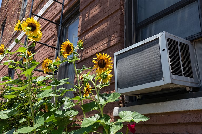 Window air conditioner outside of apartment
