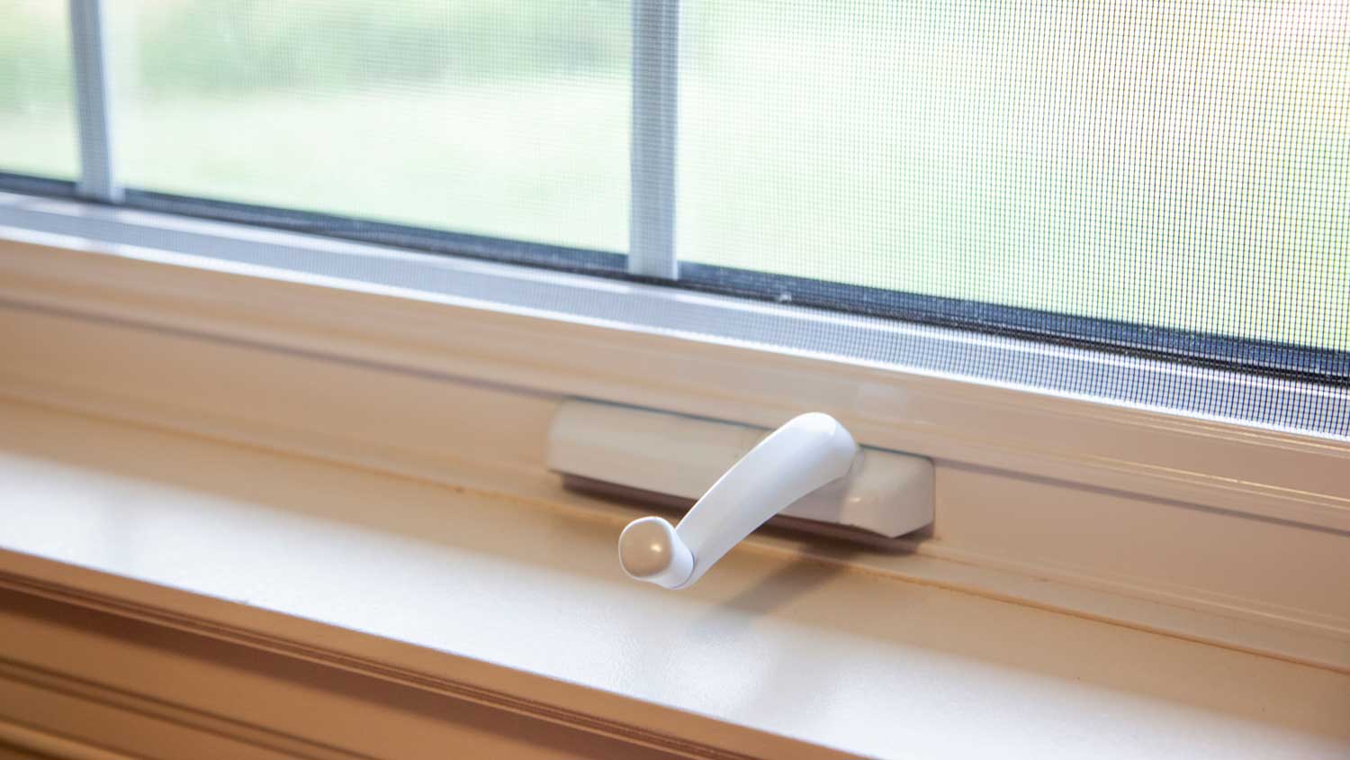 A window crank with a plastic covering