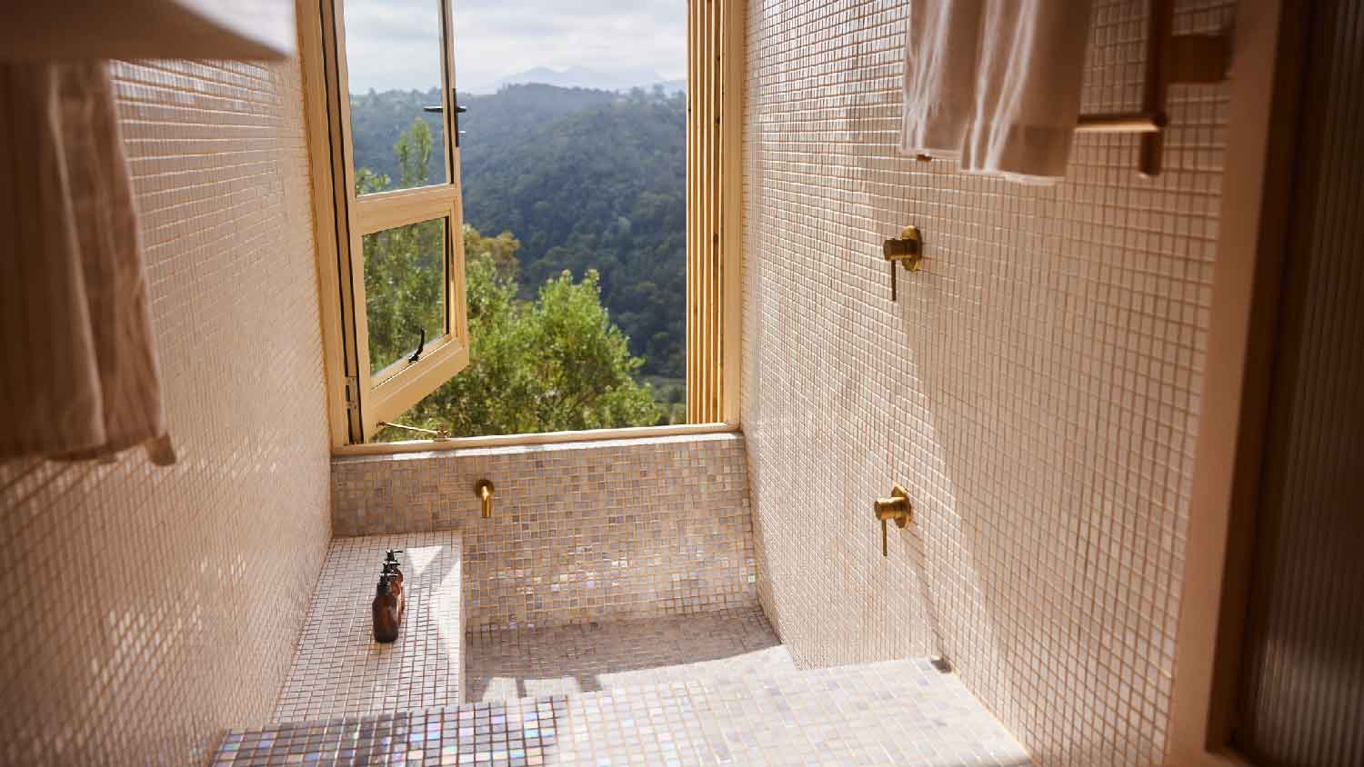 An open window to scenic views from a shower