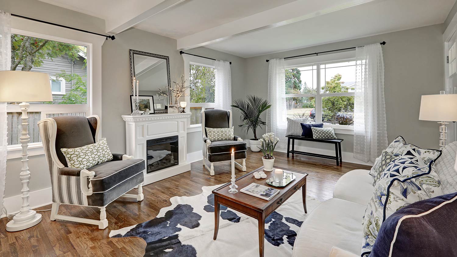 Luxurious, bright living room with big windows
