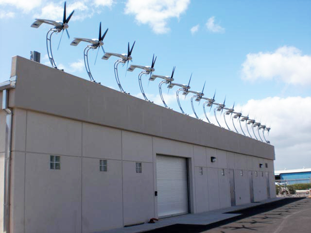 row of wind turbines on rural building