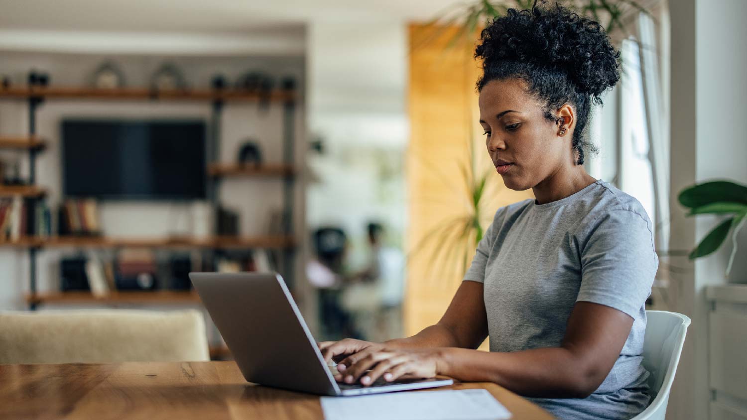 A woman applying for permits on her laptop 