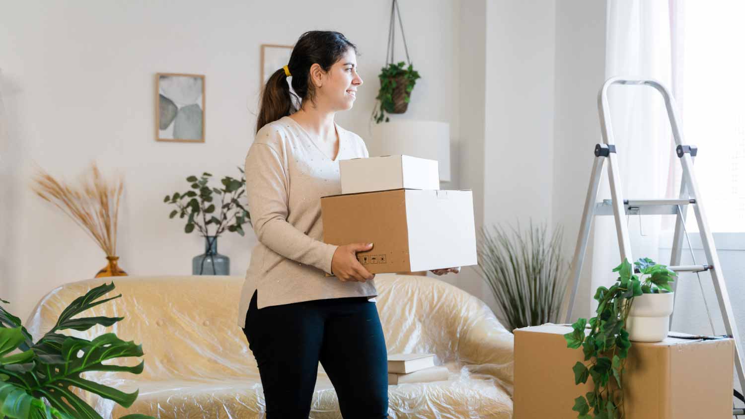 Woman carrying boxes