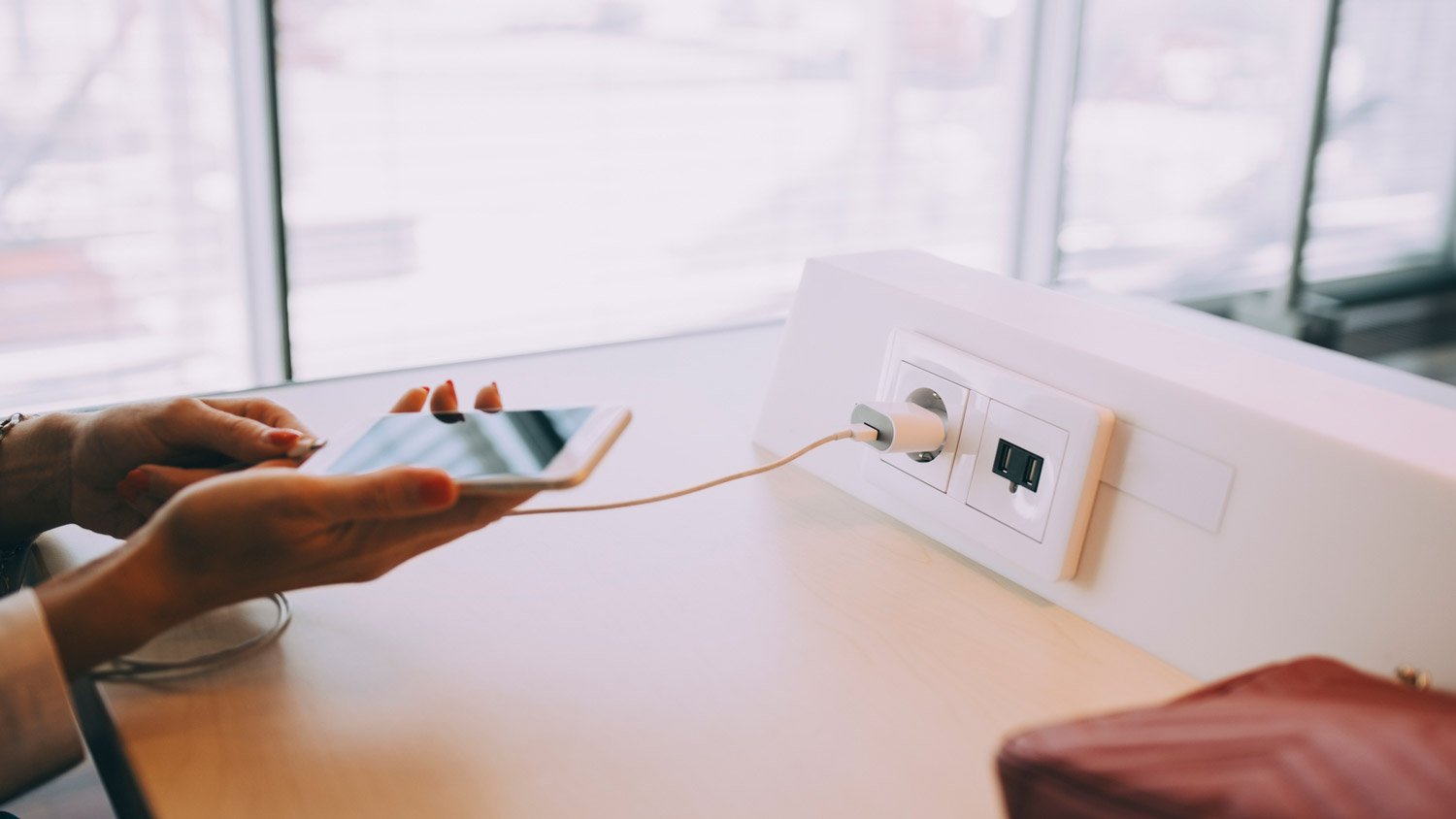 A woman charging her phone