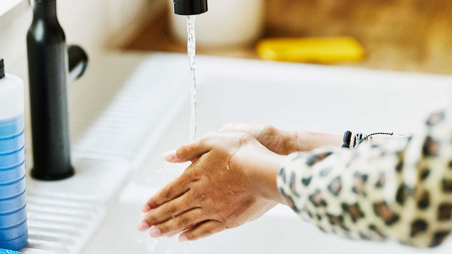 A woman checking the water pressure