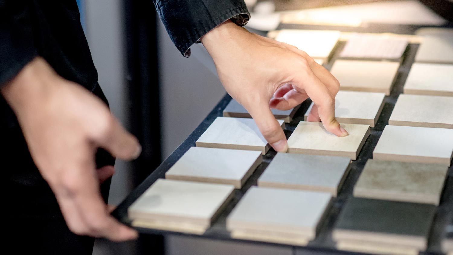 A woman choosing porcelain tiles