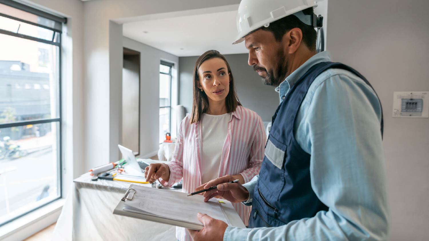 A woman discussing with a contractor