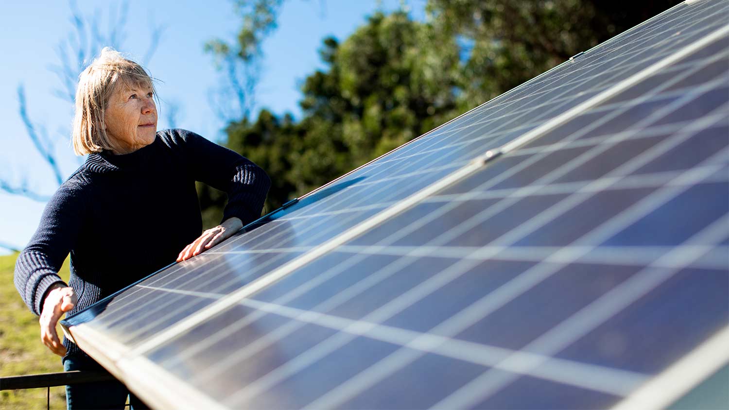 woman checking on her solar panels