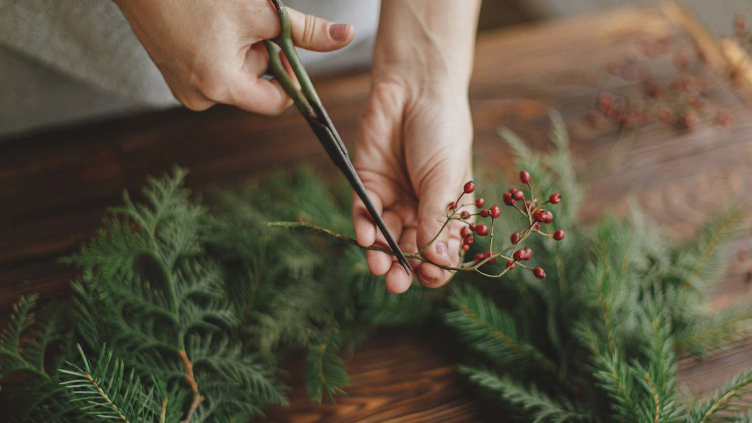 A woman making a Christmas wreath
