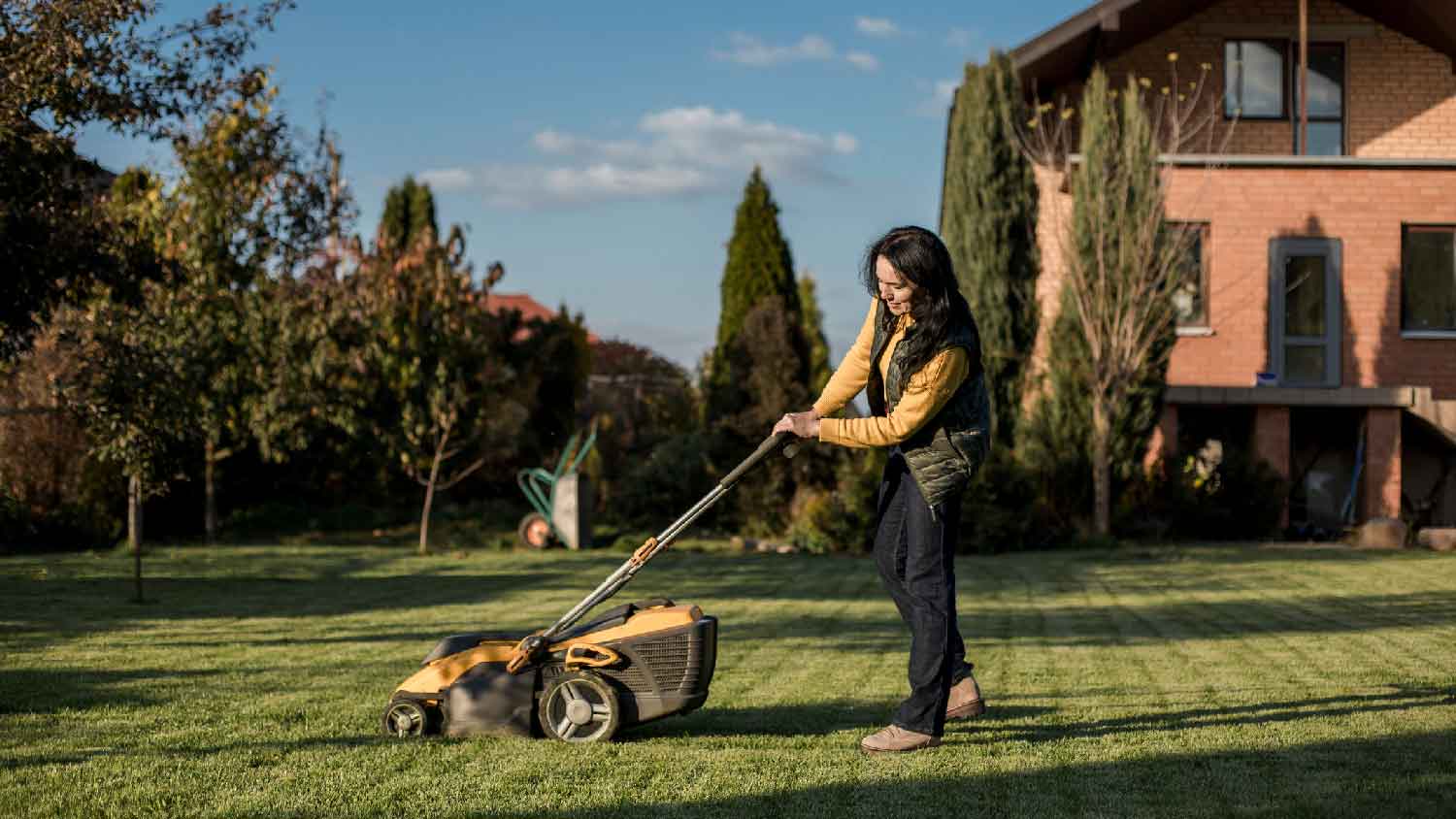 A woman mowing the lawn 