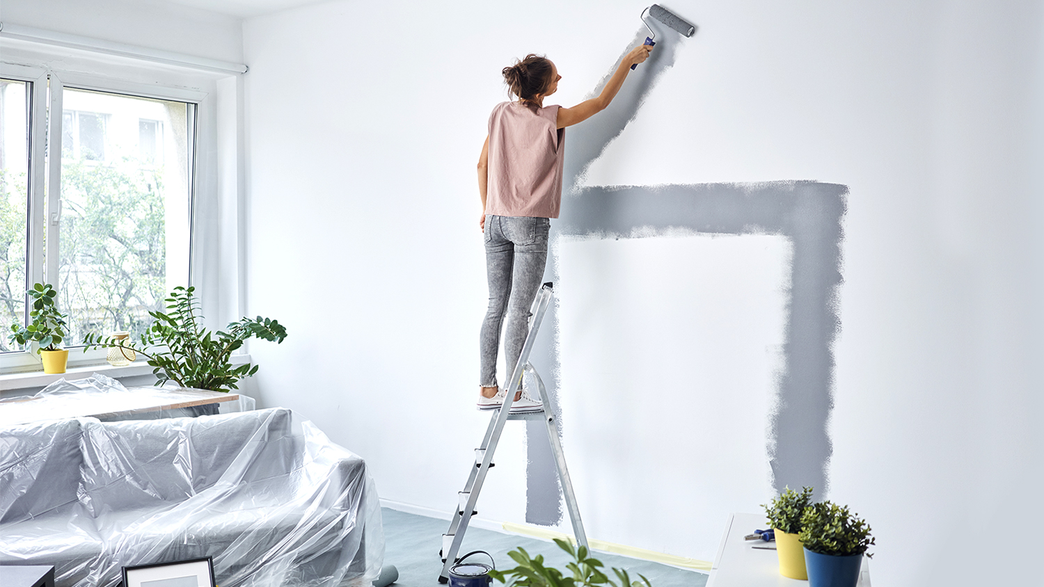 woman painting apartment