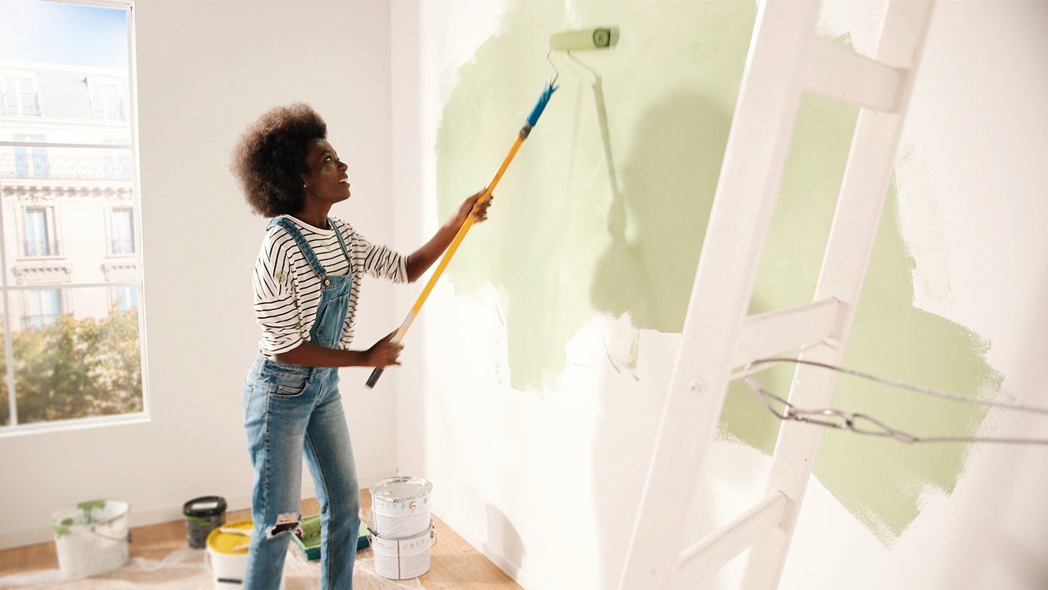 woman painting apartment