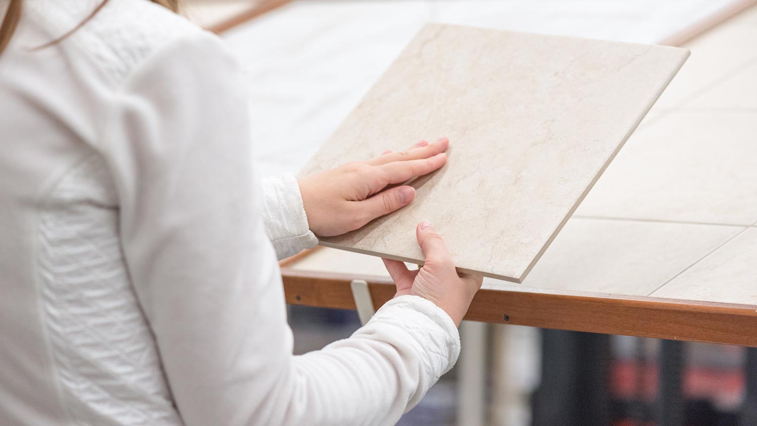 A woman shopping for ceramic tiles