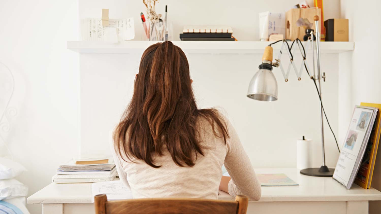 woman sitting at desk working 