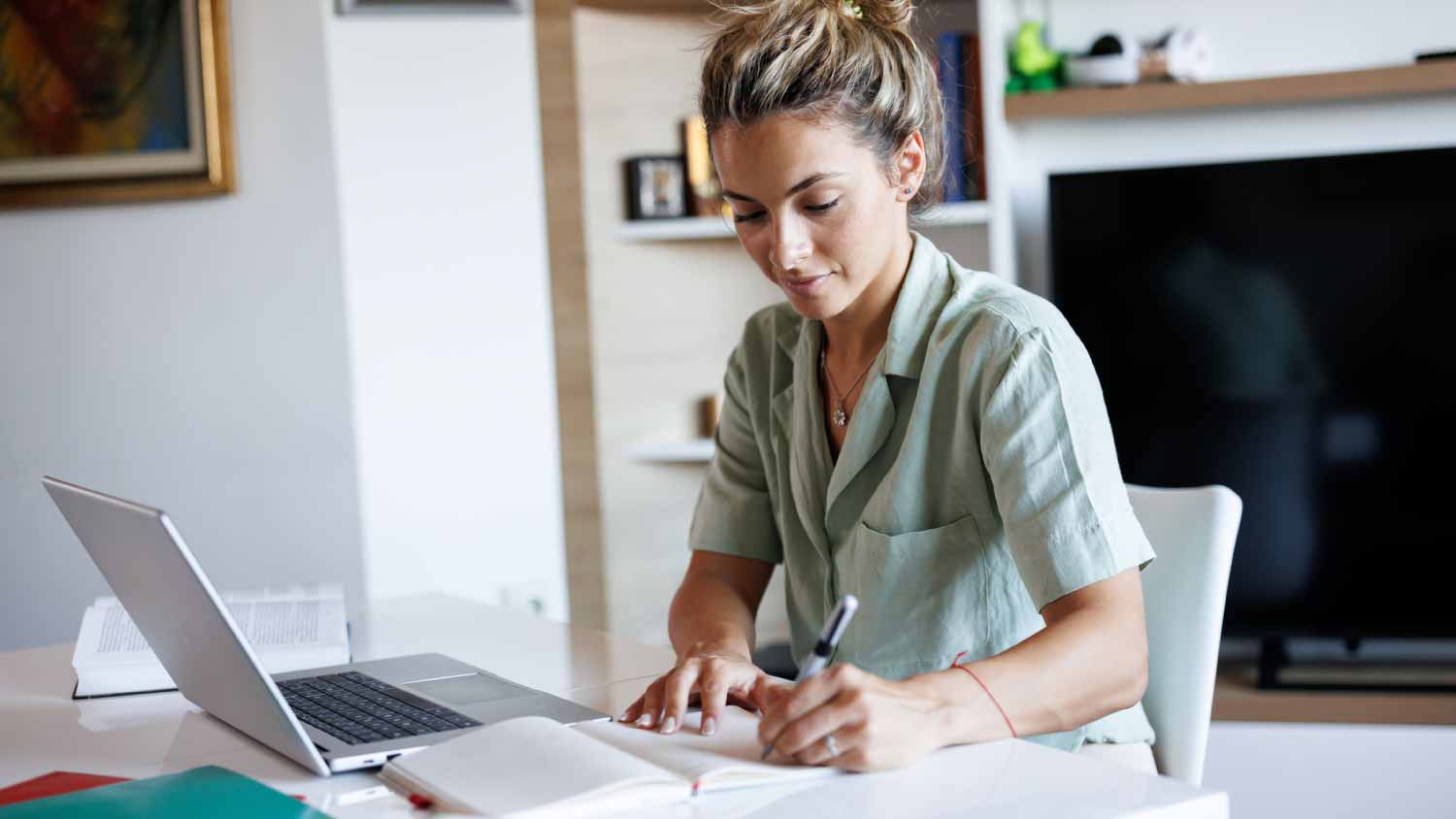 woman taking notes