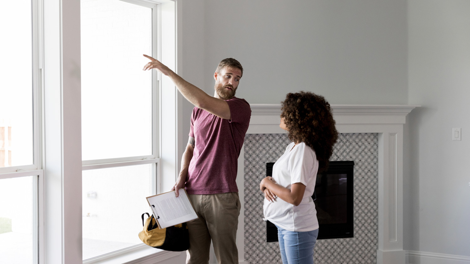 A woman talking to a contractor