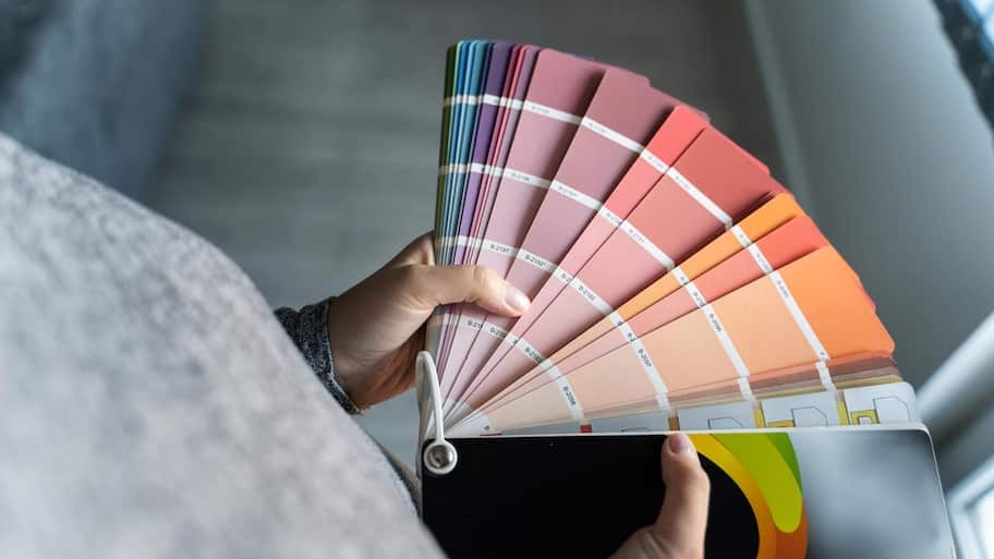 A woman holding a color palette