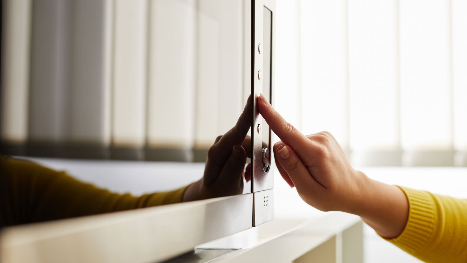 A woman using a microwave