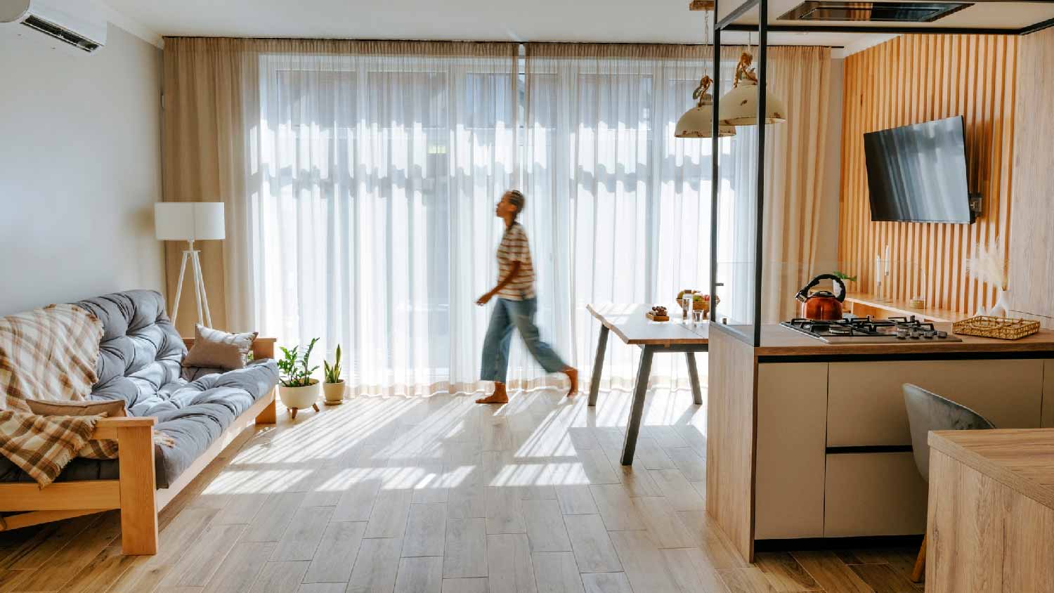 A woman walking barefoot in the house
