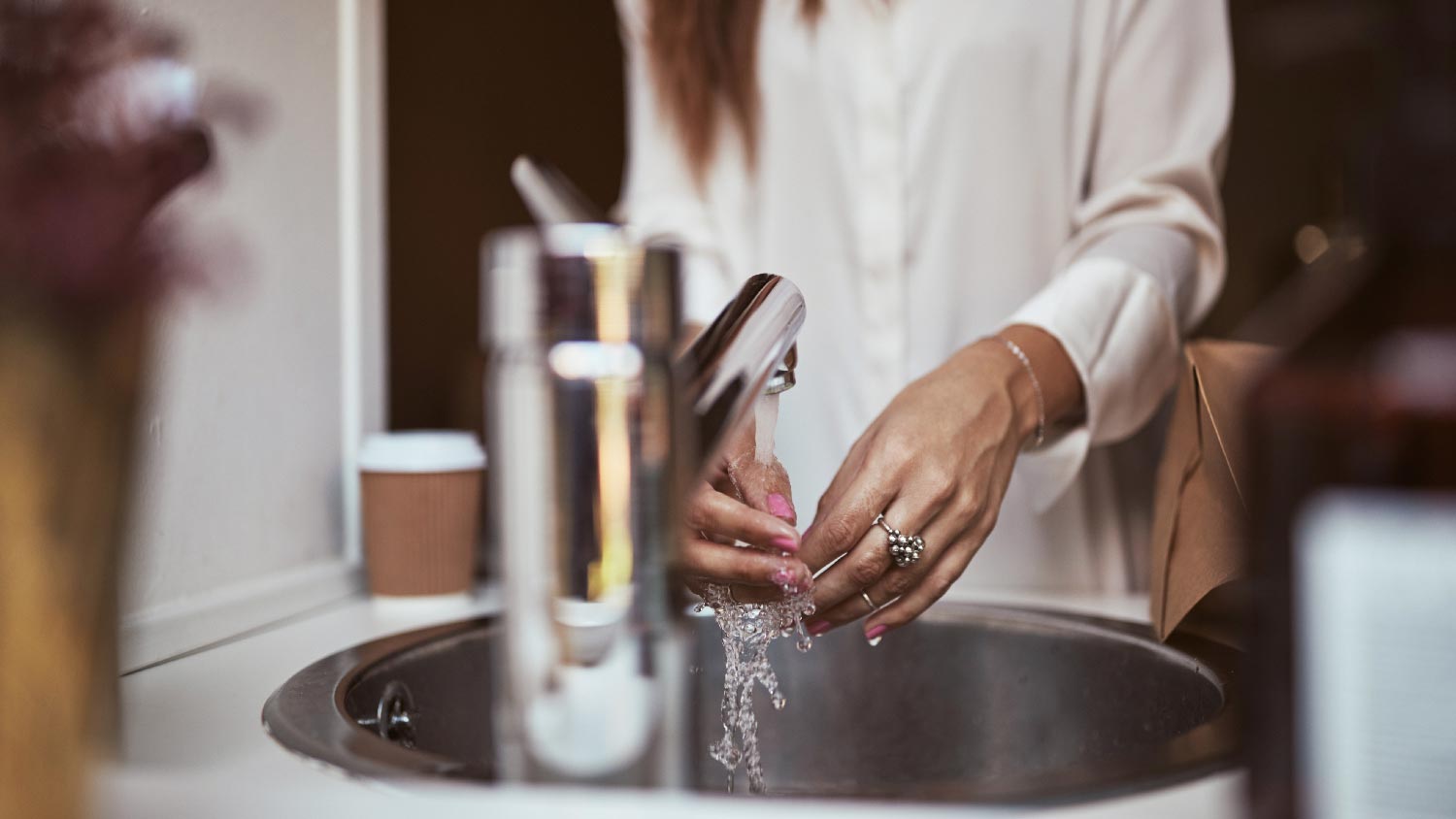 A woman washing her hands