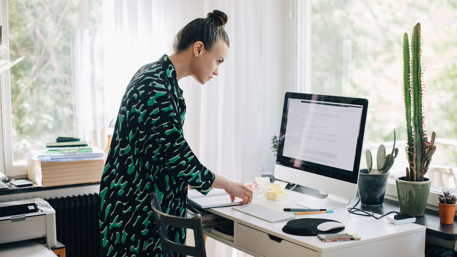 A woman working from her home office