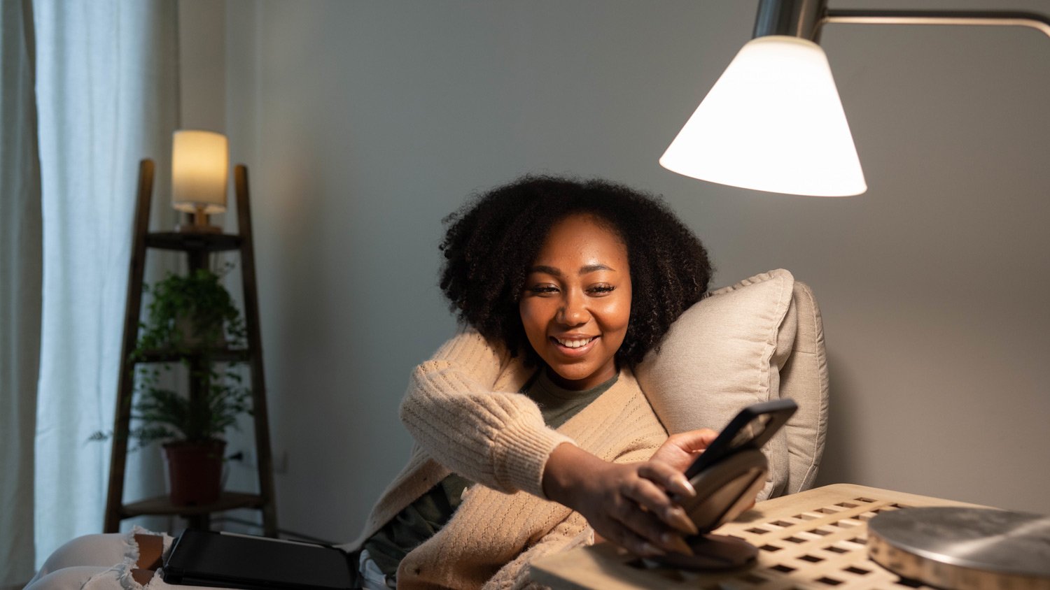 Woman putting her smartphone on wireless charger