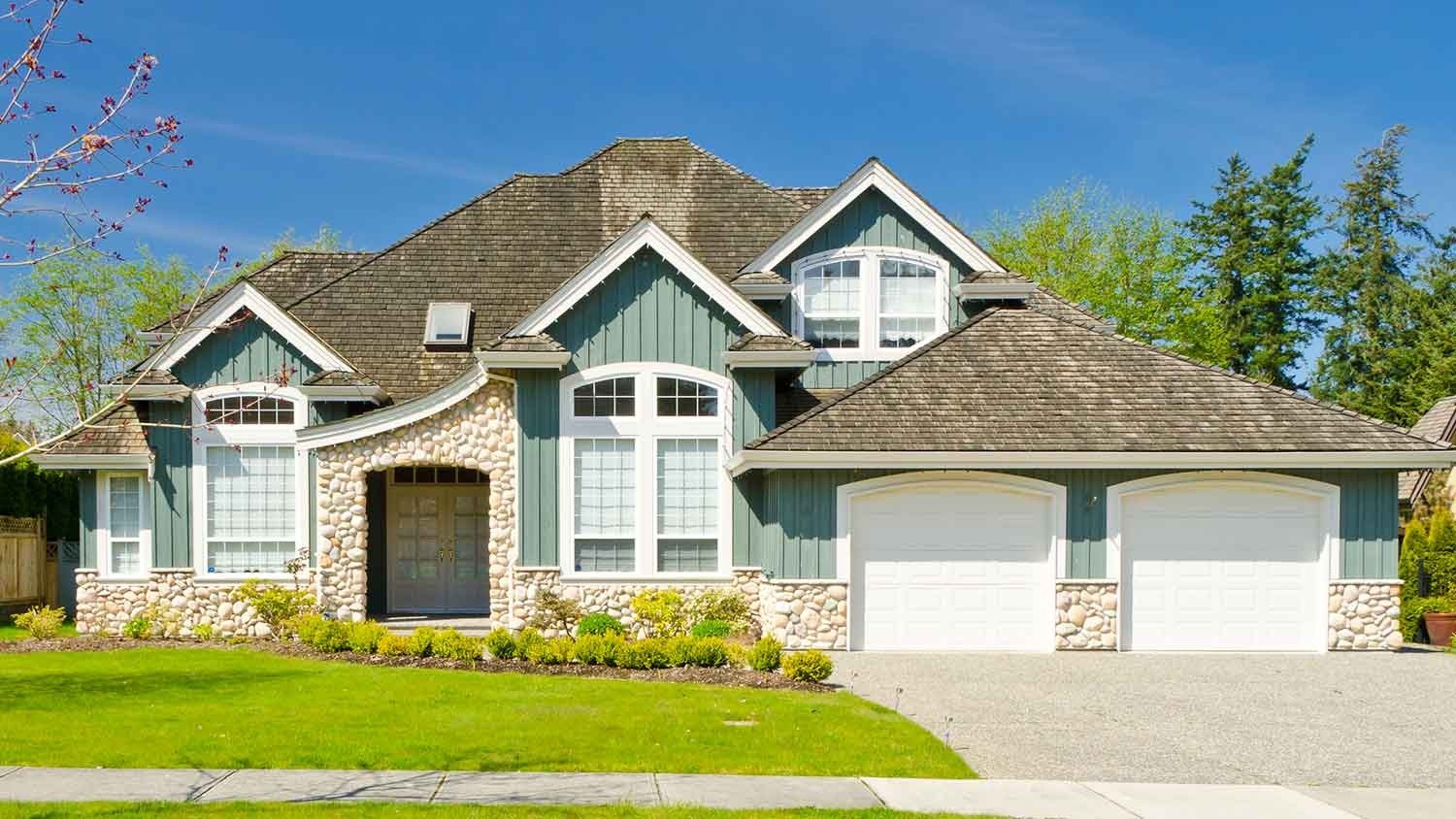 Wood and stone siding installed on a one-story house