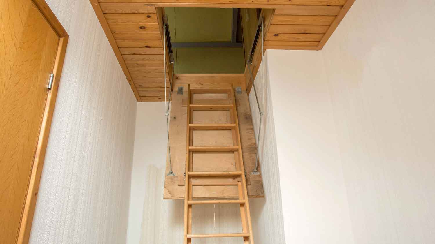 Wooden ladder to access the attic