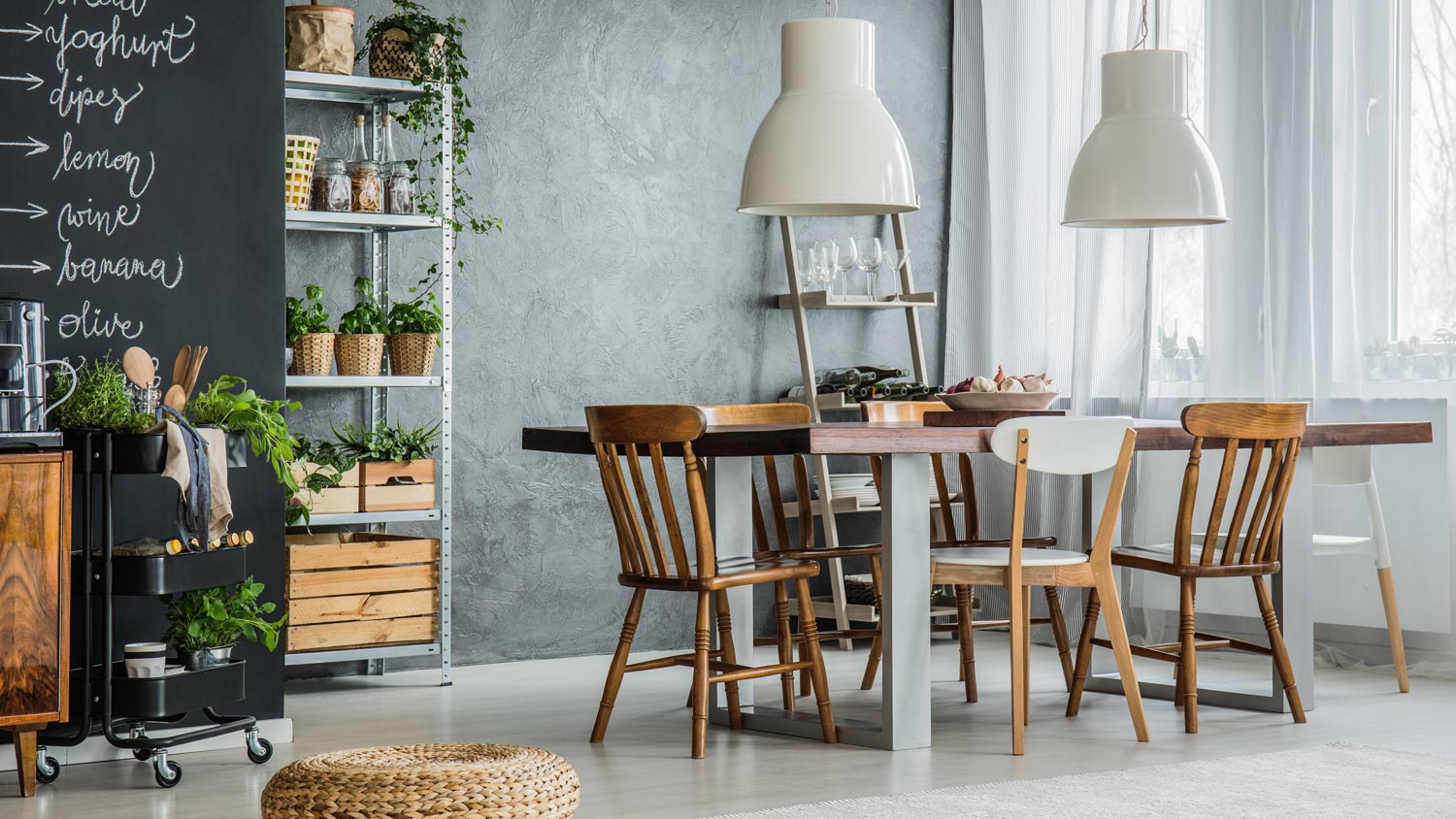 A wooden dining table with a white metallic light